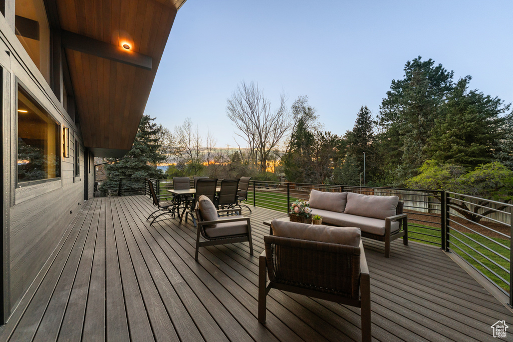 Deck with outdoor lounge area and outdoor dining area