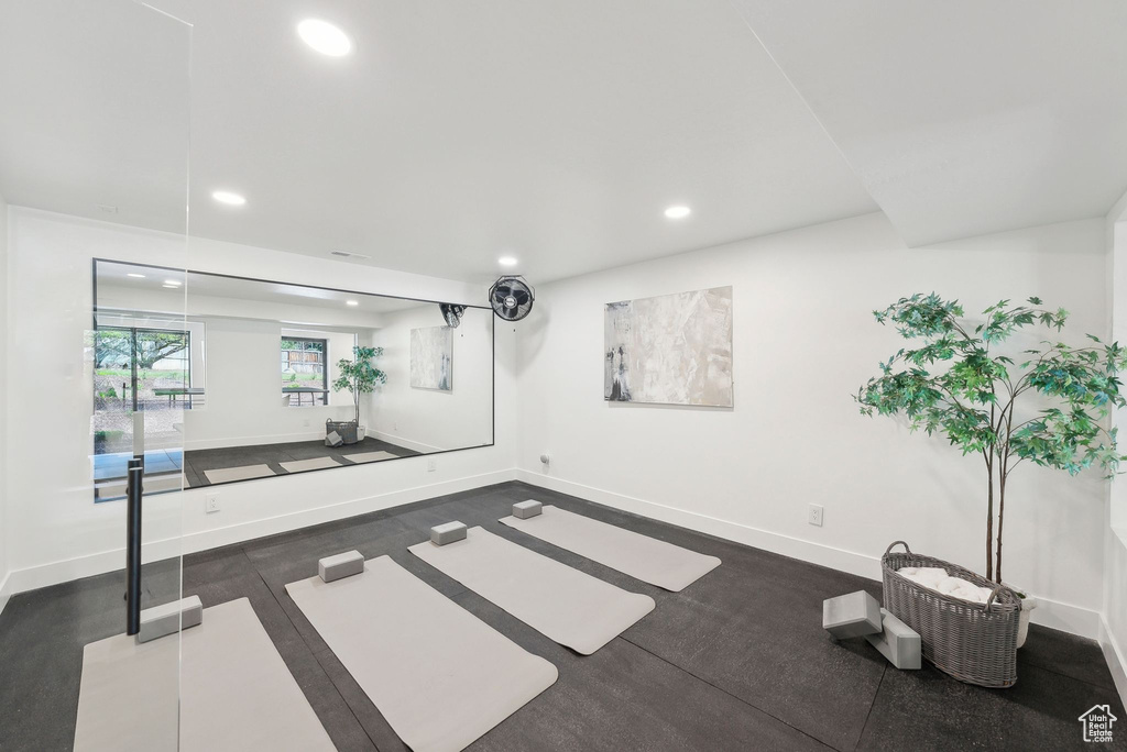 Basement with recessed lighting and baseboards
