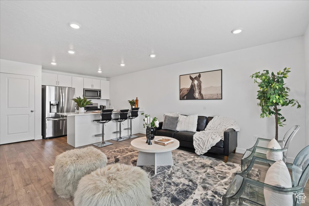 Living room featuring recessed lighting and wood finished floors