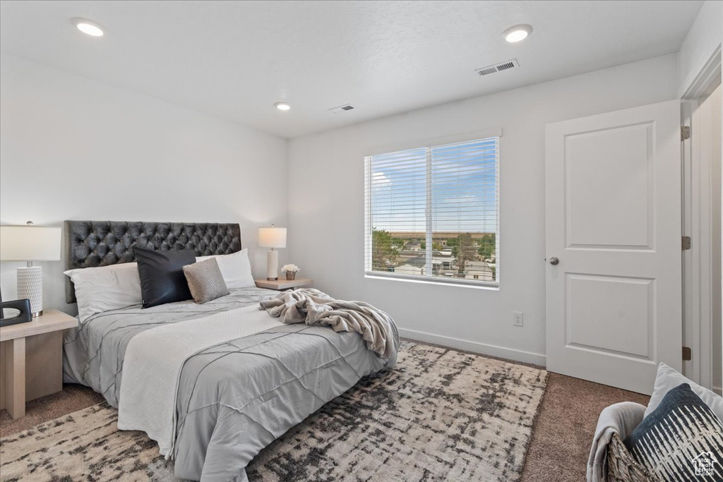 Bedroom featuring light colored carpet and recessed lighting