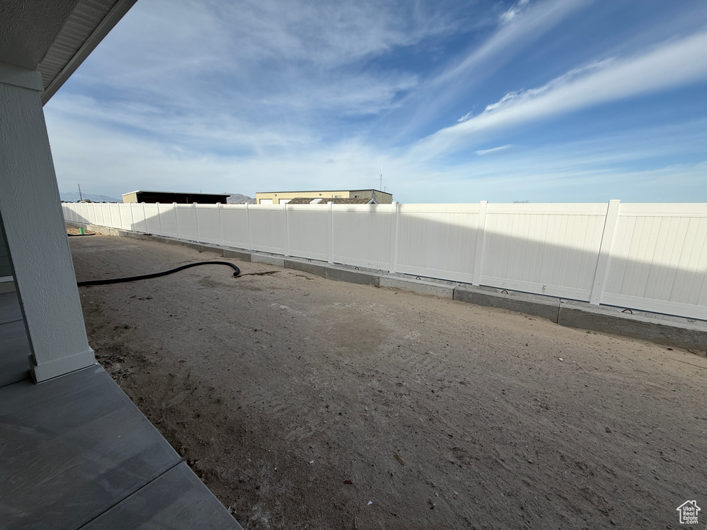 View of fenced backyard