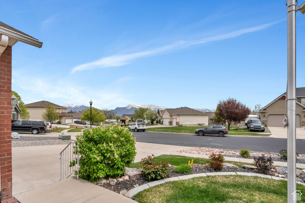 View of yard with a mountain view and a residential view