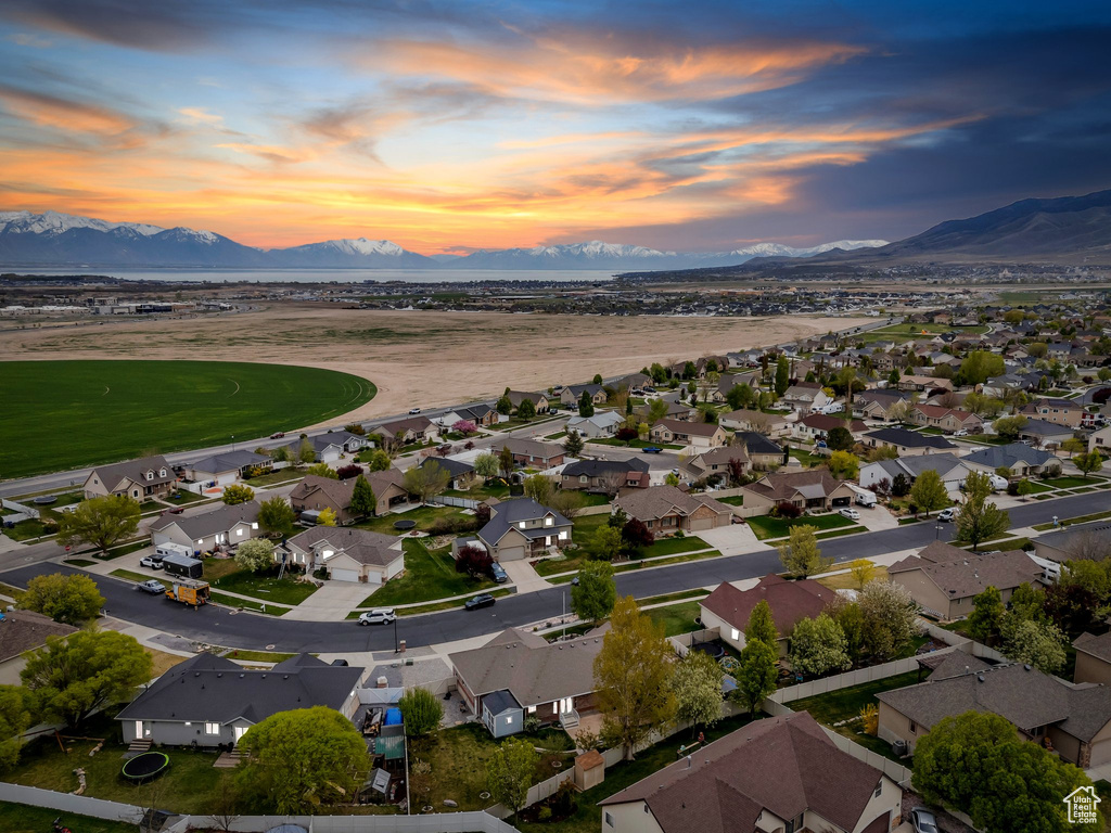 Birds eye view of property with a residential view and a mountain view