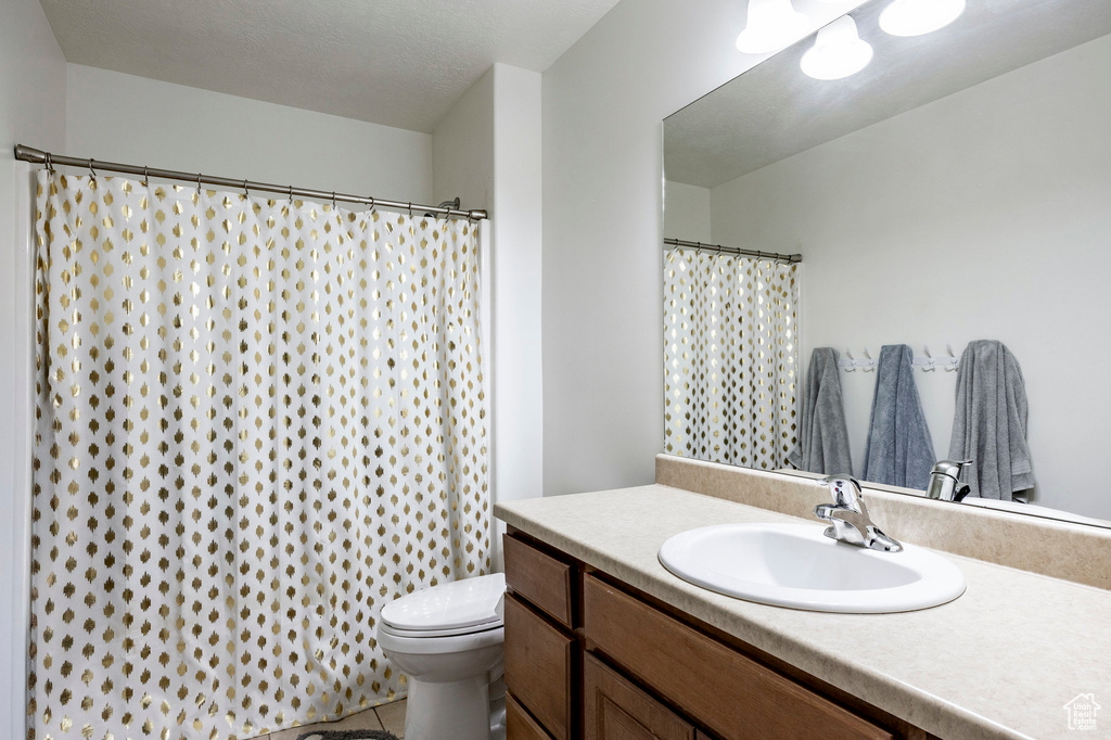 Bathroom with vanity and toilet