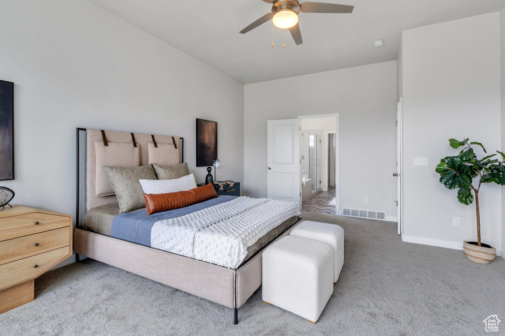 Bedroom featuring baseboards, a ceiling fan, visible vents, and carpet