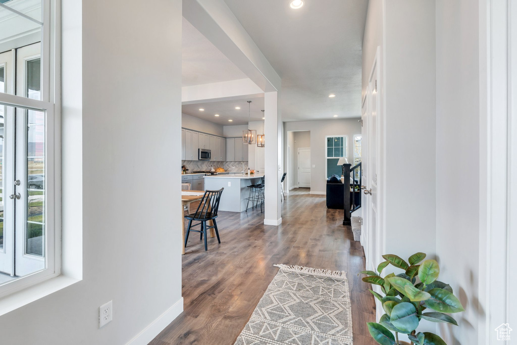 Foyer entrance with baseboards, recessed lighting, and dark wood finished floors