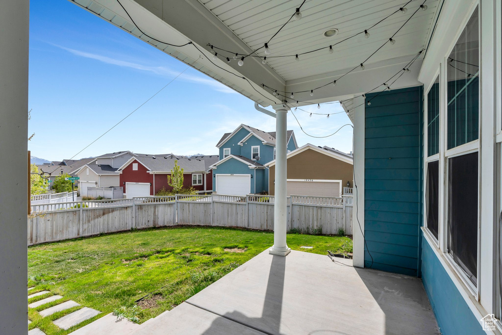 View of yard with a patio area, a residential view, and a fenced backyard