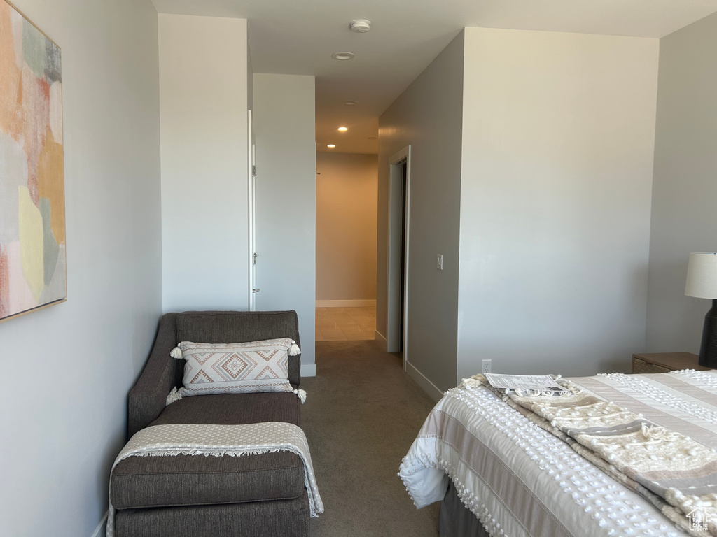 Carpeted bedroom with recessed lighting and baseboards