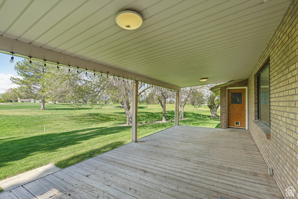 Deck featuring a lawn