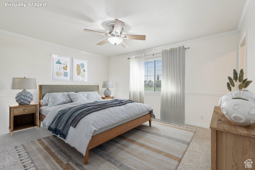 Bedroom featuring crown molding, baseboards, a ceiling fan, and carpet flooring