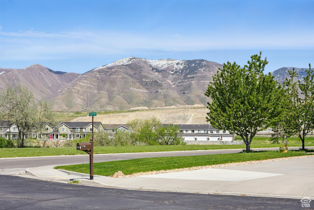 Property view of mountains with a residential view
