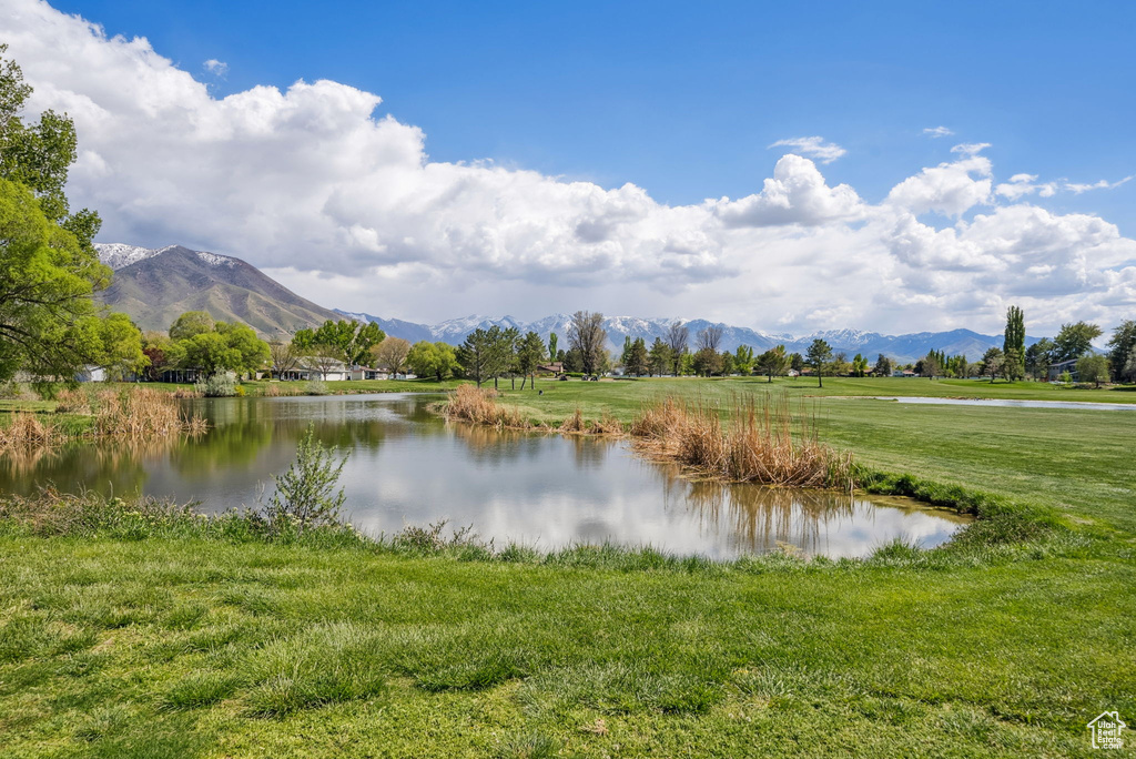View of water feature with a mountain view