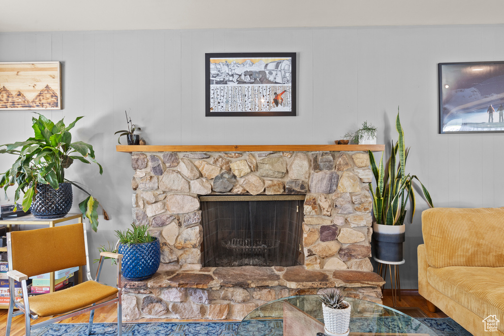Living room featuring wood finished floors and a fireplace