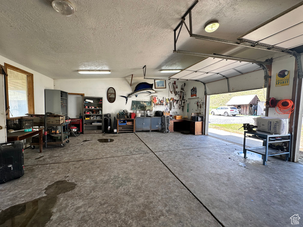 Garage featuring a workshop area