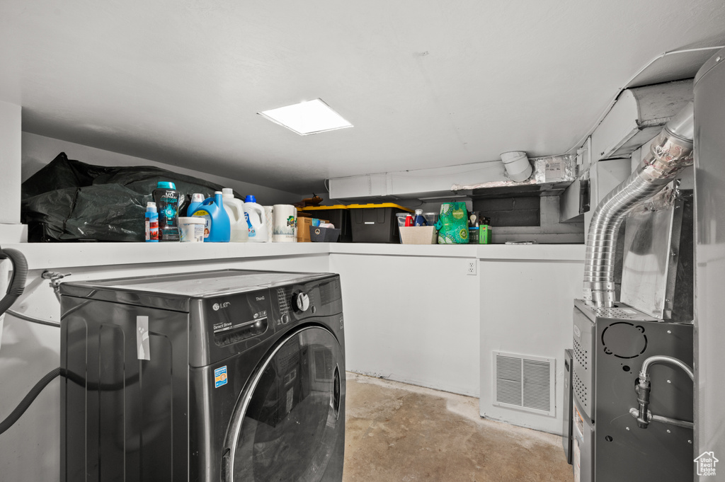 Laundry room featuring visible vents, laundry area, and washer / clothes dryer