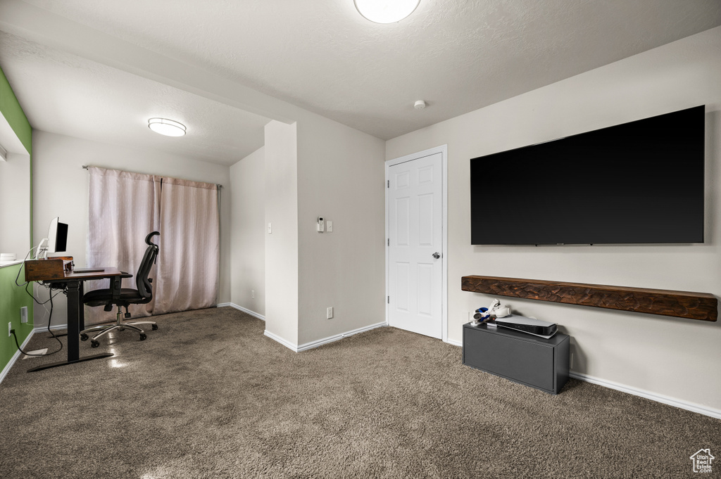 Carpeted office with baseboards