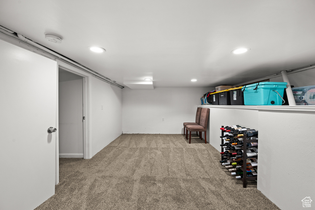 Finished below grade area with recessed lighting and carpet flooring