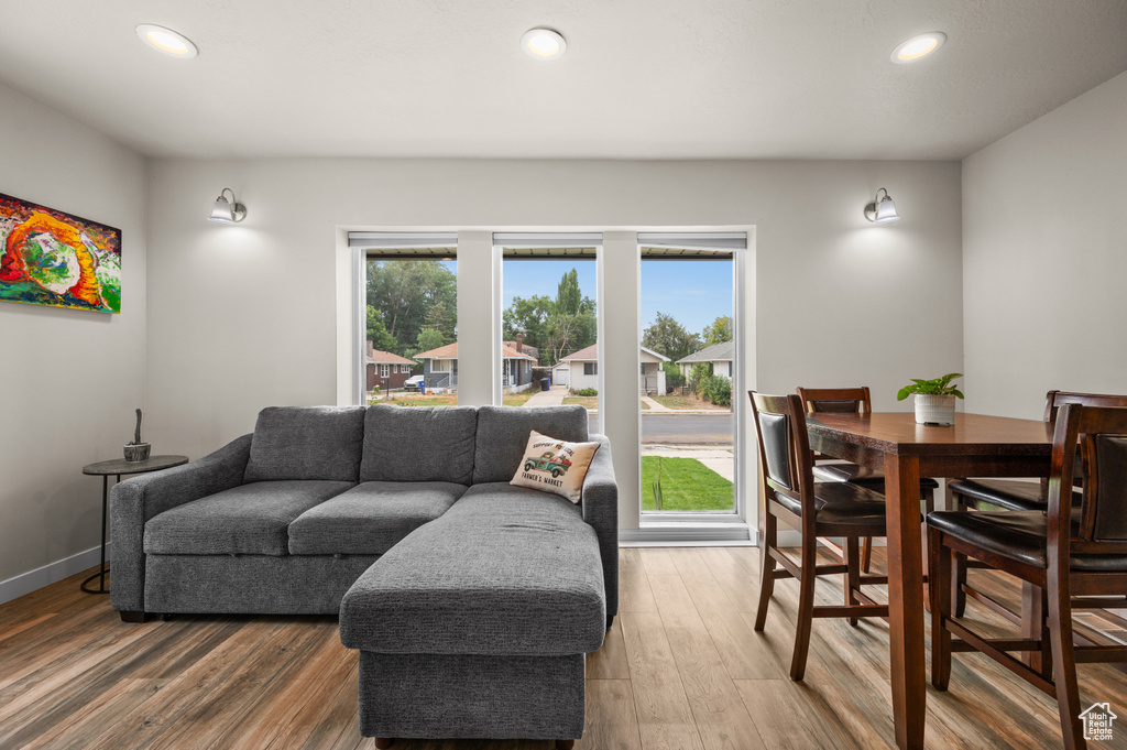 Living area featuring recessed lighting, wood finished floors, and baseboards