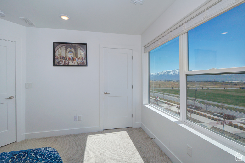 Unfurnished bedroom with recessed lighting, baseboards, visible vents, and light carpet