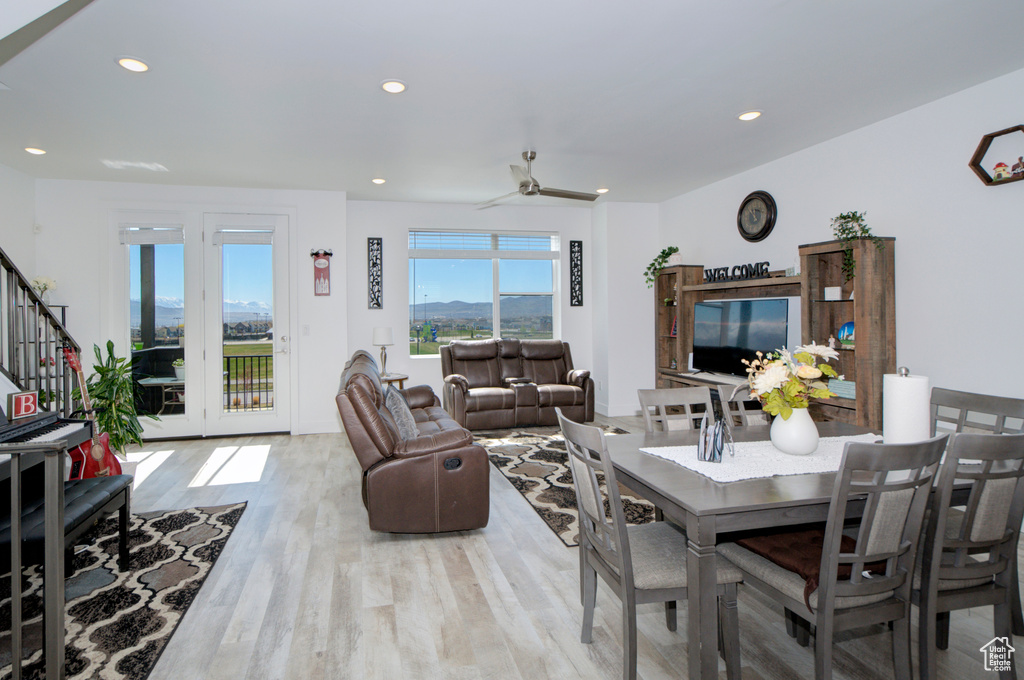 Dining room featuring recessed lighting, stairway, light wood finished floors, and ceiling fan