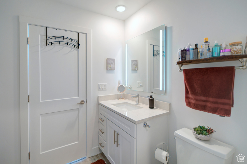 Bathroom with toilet and vanity
