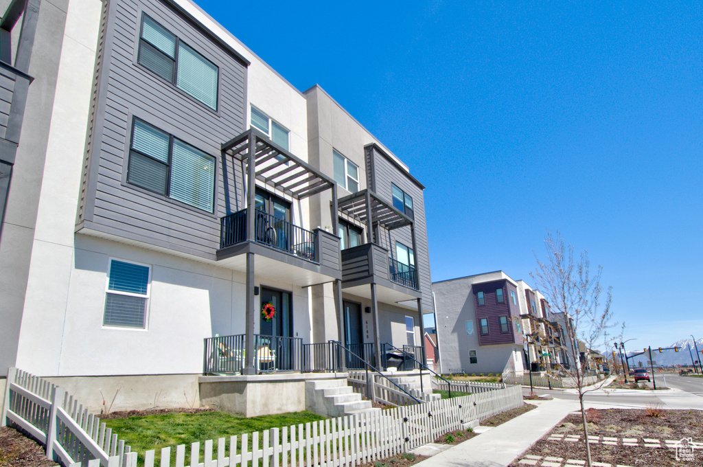 View of property with a residential view and a fenced front yard