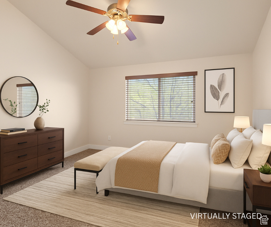 Carpeted bedroom with lofted ceiling, ceiling fan, and baseboards