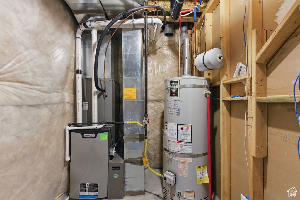 Utilities featuring strapped water heater and heating unit