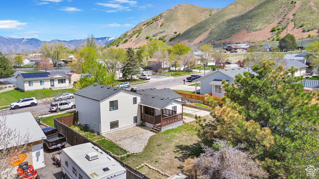 Drone / aerial view featuring a mountain view and a residential view