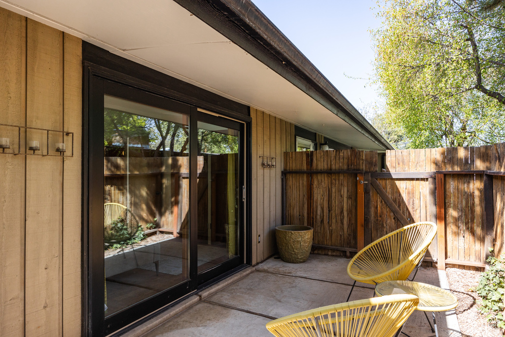 View of patio with fence