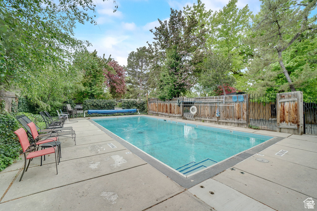 Community pool featuring fence