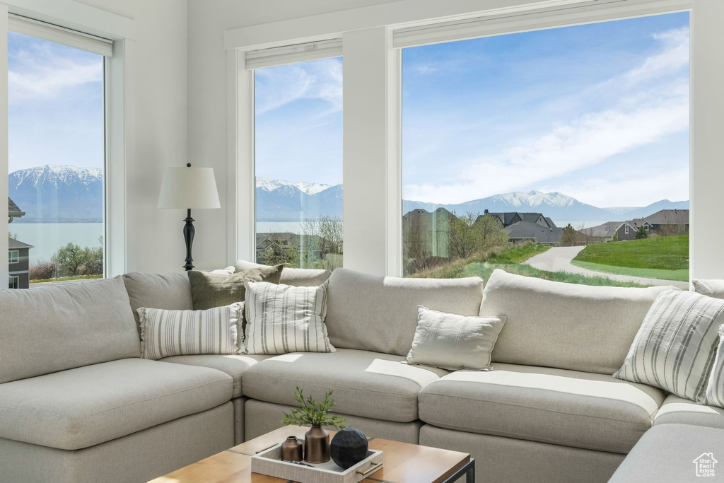 Sunroom featuring a mountain view