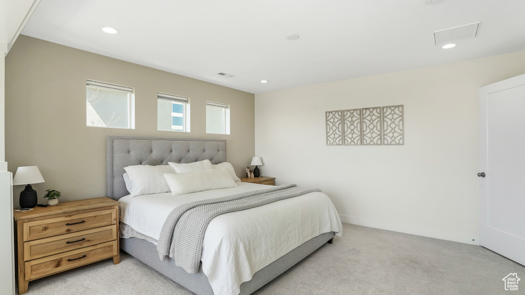 Bedroom featuring visible vents, recessed lighting, and light colored carpet