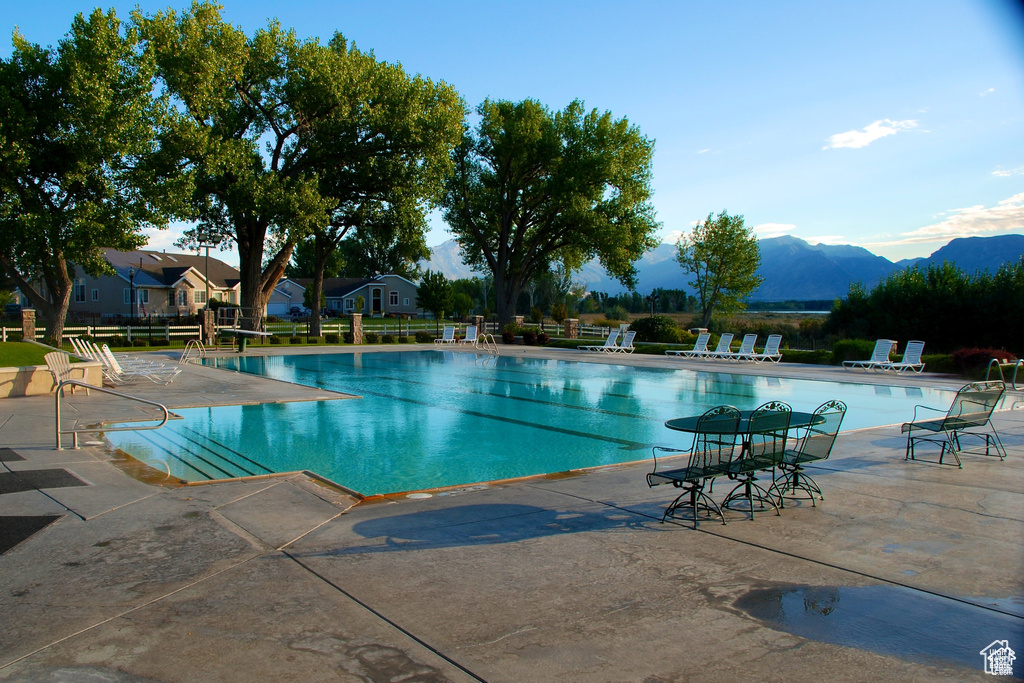 Community pool featuring a patio area and a mountain view