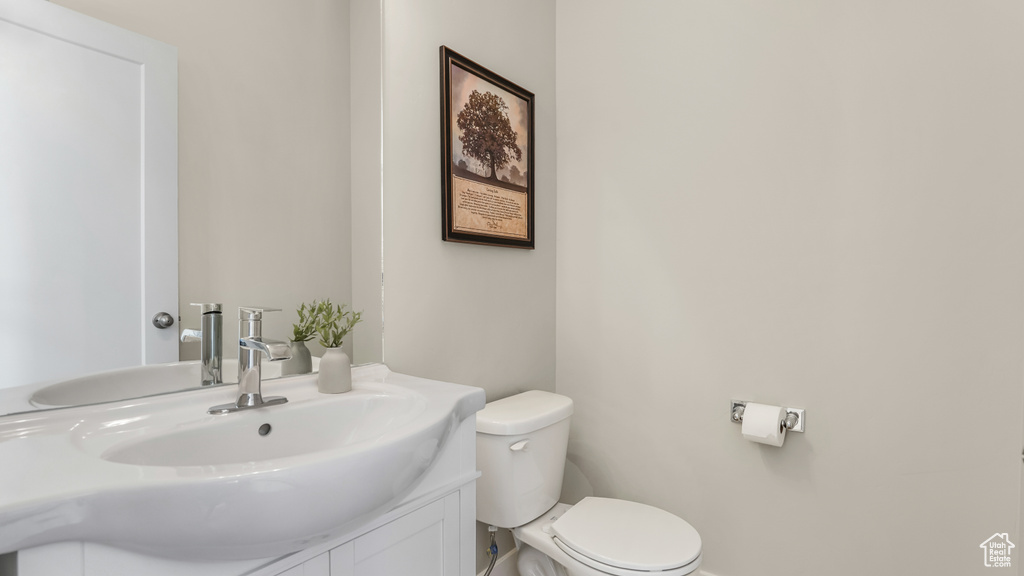Bathroom featuring vanity and toilet