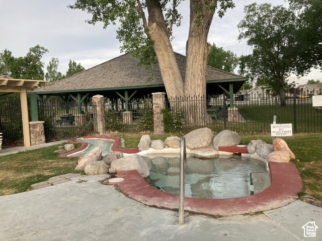 View of home\\\'s community featuring fence and a gazebo