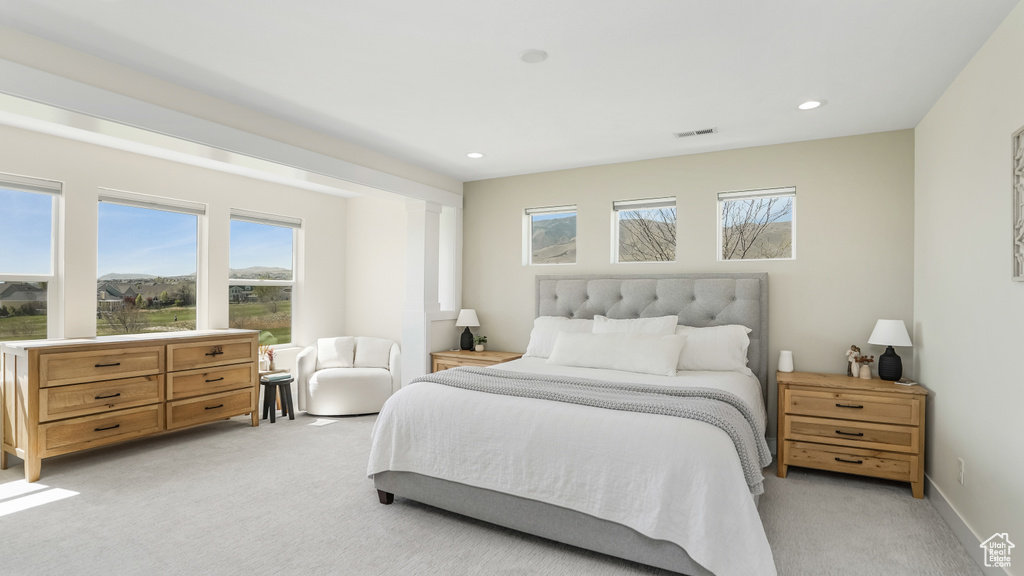 Bedroom featuring recessed lighting, visible vents, and light colored carpet