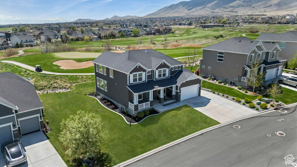 Drone / aerial view featuring a mountain view, a residential view, and view of golf course