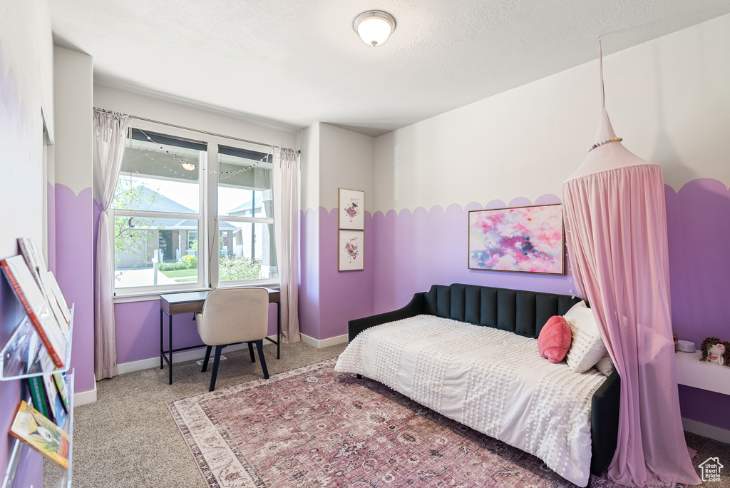 Bedroom with carpet floors and baseboards