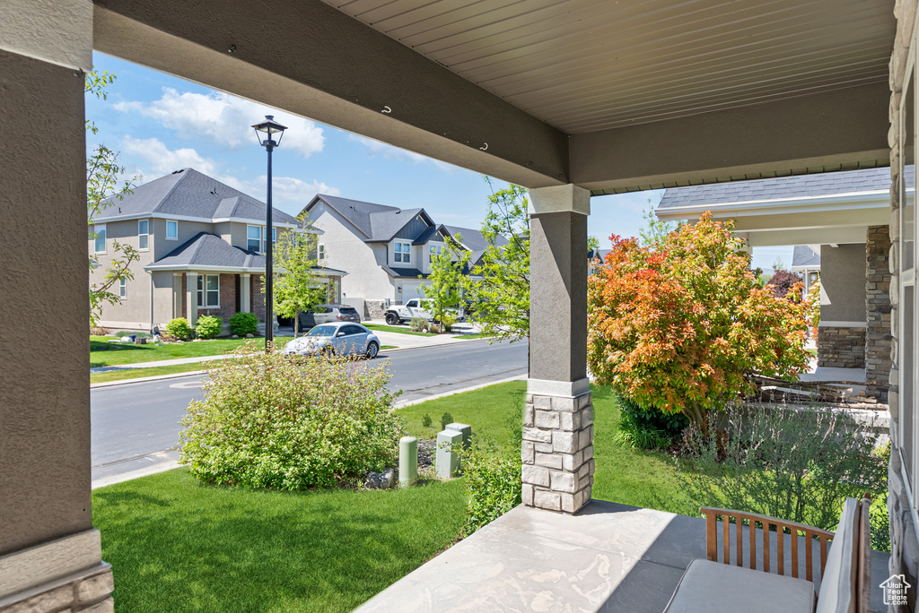 View of patio with a residential view and covered porch