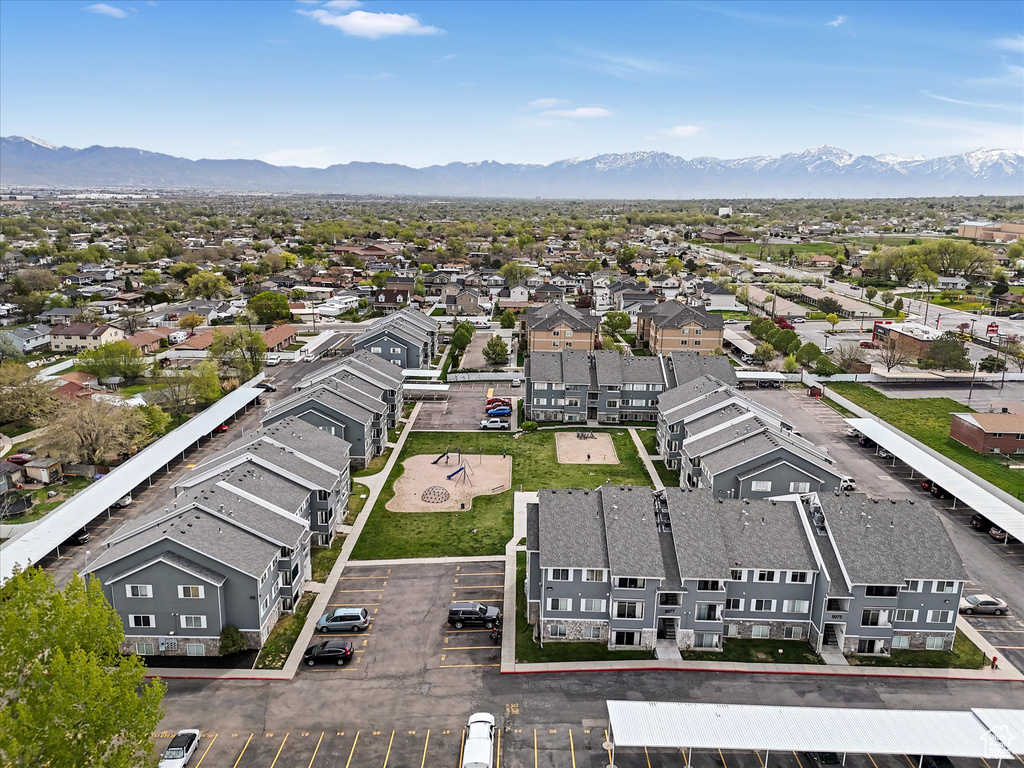 Birds eye view of property featuring a mountain view and a residential view