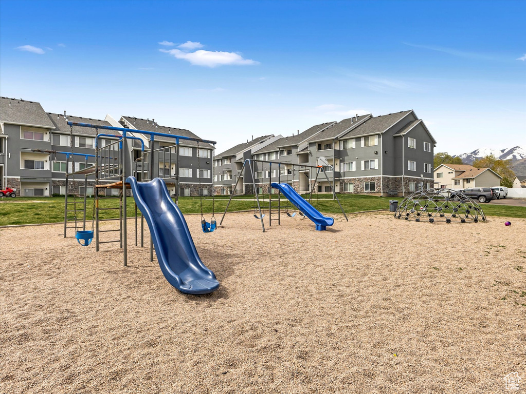 Community playground featuring a residential view