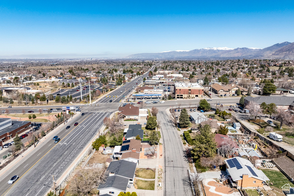 Aerial overview of property's location featuring a major roadway, mountains, and nearby suburban area