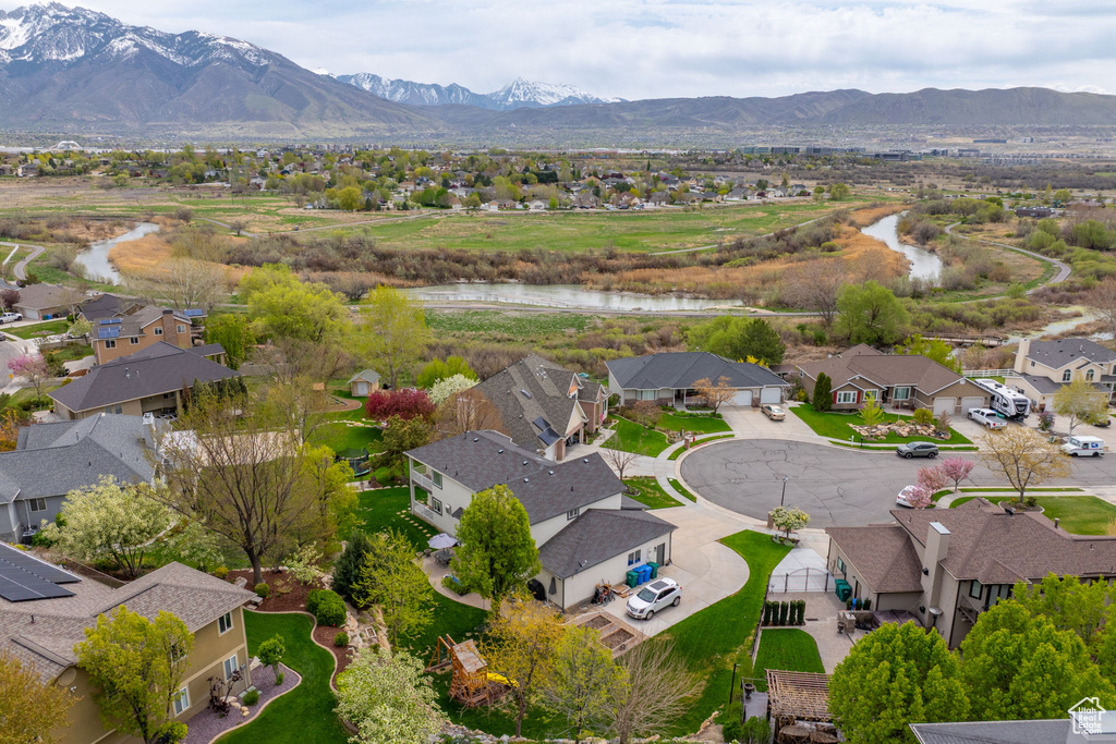 Bird's eye view featuring a water and mountain view and a residential view