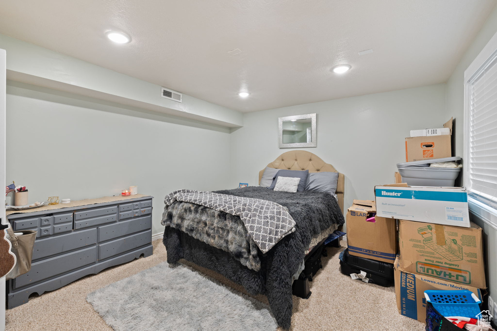 Bedroom with visible vents, carpet, and recessed lighting