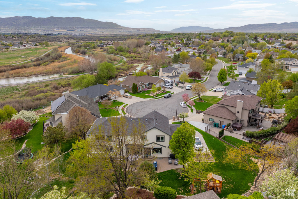 Birds eye view of property featuring a mountain view and a residential view