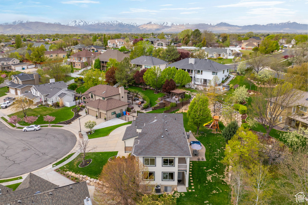Birds eye view of property with a mountain view and a residential view
