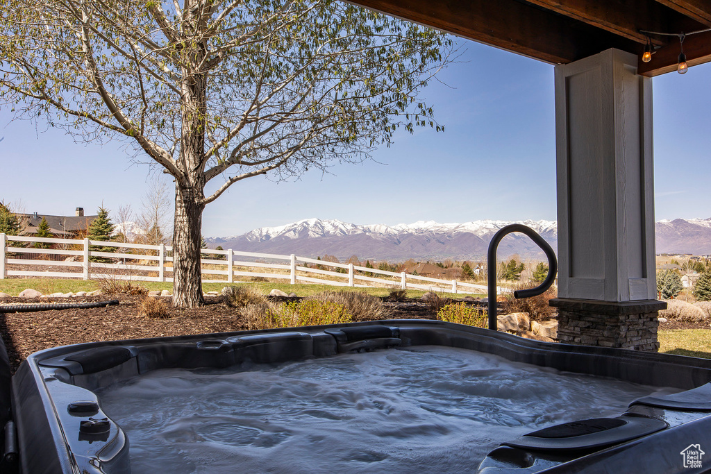 Exterior view of a hot tub and a mountainous background