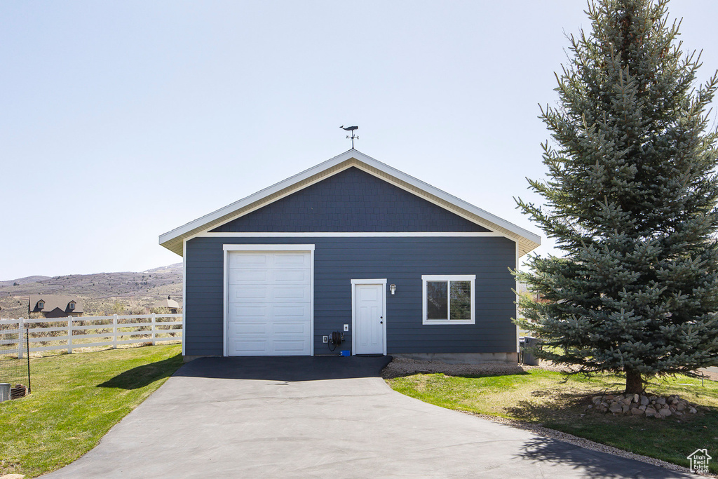 Garage featuring a mountain view
