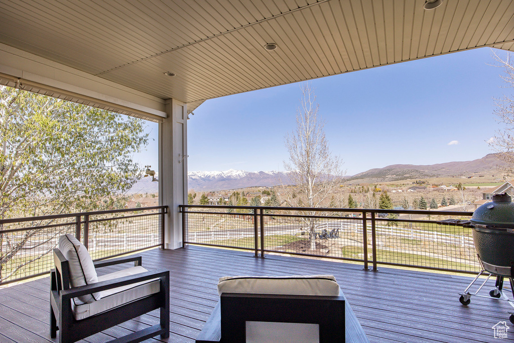 Wooden deck featuring a mountain view